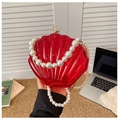 Detail of red acrylic shell evening bag with luxury pearl handle and metallic closure - Style 1 Red