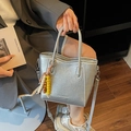 Chic silver metallic bucket bag with textured pleats and beaded tassel decoration - Silver