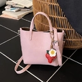 Pink leather bucket tote bag with strawberry charm and adjustable shoulder strap - Pink with Pendant