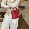 Red leather mini bucket bag with strawberry charm and adjustable shoulder strap - Red with Pendant