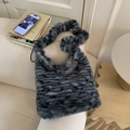 Close-up of fluffy faux fur shoulder bag with grey stripes and scrunchie strap - Tiger Gray