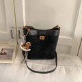 Black minimalist bucket bag in leather and suede with a gold lock and horse charm - Black
