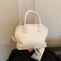 Minimalist white shell-shaped handbag in faux leather with top handles and adjustable strap - Plain White