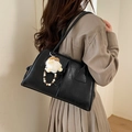 Minimalist black faux leather shoulder bag with plush ball and wooden bead detail - With Charm / Black