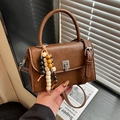 Brown retro PU leather handbag with silver rotary lock and colorful wooden bead tassel - Brown