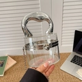 Clear acrylic cylinder handbag with silver liquid metal handle and chain strap - Clear