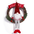 Christmas gnome wreath with a brown rattan base and a festive red sequin hat welcome sign - Red