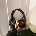 Dark brown pleated dumpling bag with silver chain strap and colorful beaded charm - Black