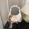 Chic beige pleated half-moon bag with wooden beads and silver chain handle detail - White