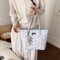White tote bag with light blue cartoon prints and a cute plush dog charm accessory - With Charm / Blue