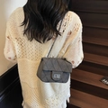 Dark gray quilted chain bag in thick fabric with silver mademoiselle lock and crossbody strap - Black