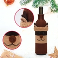 Close-up of reindeer knitted wine bottle cover with 3D antlers and plush details - Reindeer