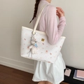 White quilted tote bag with floral patterns and a cute plush bear charm for daily commute - With Charm / Off White