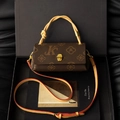 Retro monogram crossbody bag in brown canvas with a woven leather handle and gold lock - Coffee & Apricot