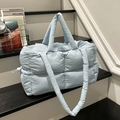 Lichtblauwe gewatteerde puffer draagtas met handvatten en verstelbare riem - Blauw