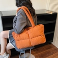 Quilted puffy tote bag in vibrant orange with large square stitching and wide handles - Orange
