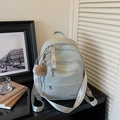 Light grey textured faux leather backpack with plush pendant and embroidered straps - With Charm / Green