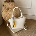 White bucket bag with pleated texture, wood bead tassel and detachable shoulder strap - White