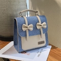 Zaino in denim blu e pelle crema con fiocchi decorativi e dettagli in metallo - Azzurro