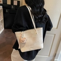 Large cream tote bag in leather and woven fabric with cute brown bear charm accessory - With Charm / Off White