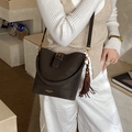 Dark brown matte PU leather bucket bag with gold buckle and tassel detail for women - With Charm / Brown