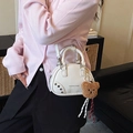 White faux leather bowling bag with silver studs and a brown plush bear keychain - With Charm / White
