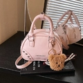 Pink mini bowling bag with plush bear charm and textured PU finish crossbody style - With Charm / Pink