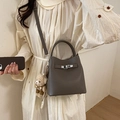 Grey litchi grain leather bucket handbag with adjustable strap and cute bear charm - With Charm / Gray