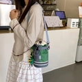 Outdoor crossbody water bottle bag in grey and green plaid with adjustable blue strap - With Charm / Green