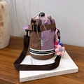 Brown and purple checkerboard drawstring bucket bag with pink flower charm and strap - With Charm / Purple