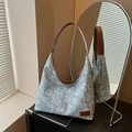 Light blue floral canvas tote bag with brown leather handles and flower print - Blue