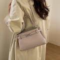 Minimalistische Kelly-tas van leer met lychee-korrel in oudroze met schouderriem - Paars