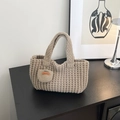 Handmade waffle knit bucket bag in beige-grey featuring a leather Hand Made tag - Khaki