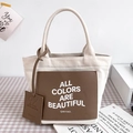 Chic beige canvas tote bag with brown leather pocket and contrast strap details - Small / Brown