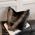 Black leather hobo bag with ethnic geometric wide strap and gold hardware accents - Black