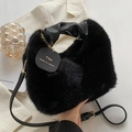 Chic black plush faux fur handbag with leather handle and gold chain detail - Black