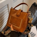 Brown leather bucket bag with retro litchi pattern and ethnic style woven strap - No Pendant / Black