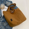 Brown canvas tote bag with side logo tag and zipper closure for autumn fashion - No Pendant / Brown