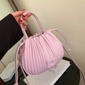 Pink pleated bucket bag for women featuring a textured finish and versatile crossbody strap - Pink