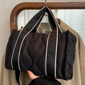 Quilted black nylon tote bag with striped woven handles and waterproof finish - Black