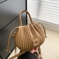 Chic pleated bucket bag in apricot beige featuring a round handle and adjustable strap - Khaki