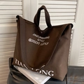 Large dark brown canvas tote bag with shoulder strap and white logo print - Brown