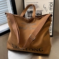 Brown canvas tote bag with large letter print and adjustable shoulder strap for women - Dark Brown