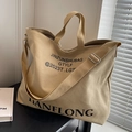 Large beige and brown canvas tote bag with shoulder strap and black typography print - Light Khaki