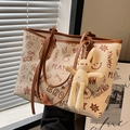 Large beige graffiti tote bag with brown handles and a cute rabbit charm accessory - With Ornament / Brown