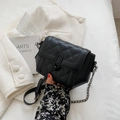 Minimalist black quilted crossbody bag with U-shaped matte buckle and chain strap - Black