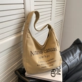Minimalist beige canvas tote bag for women featuring stylish typography and shoulder straps - Khaki