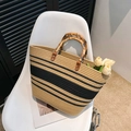 Handwoven straw tote bag with black stripes, bamboo handles, and spacious design - Khaki