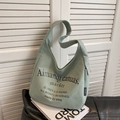 Light green canvas tote bag with black minimalist typography in a stylish design - Matcha Green