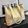 Large cream tote bag with light green contrast handles and trim in a lifestyle setting - White & Green